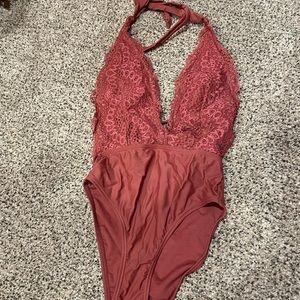 One piece swimsuit with lacy design top